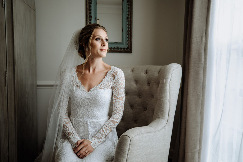 bridal portrait looking out a window