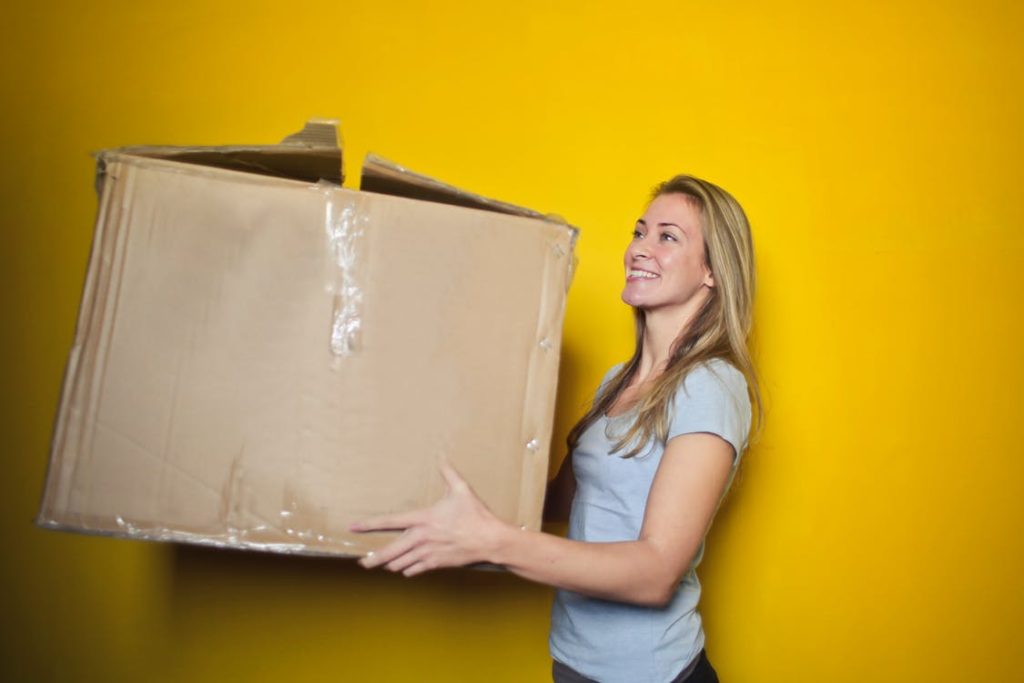 woman delivering large brown box