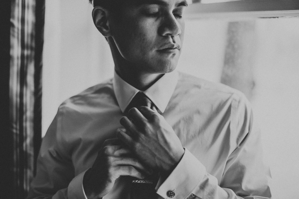 black and white wedding photography portrait of groom
