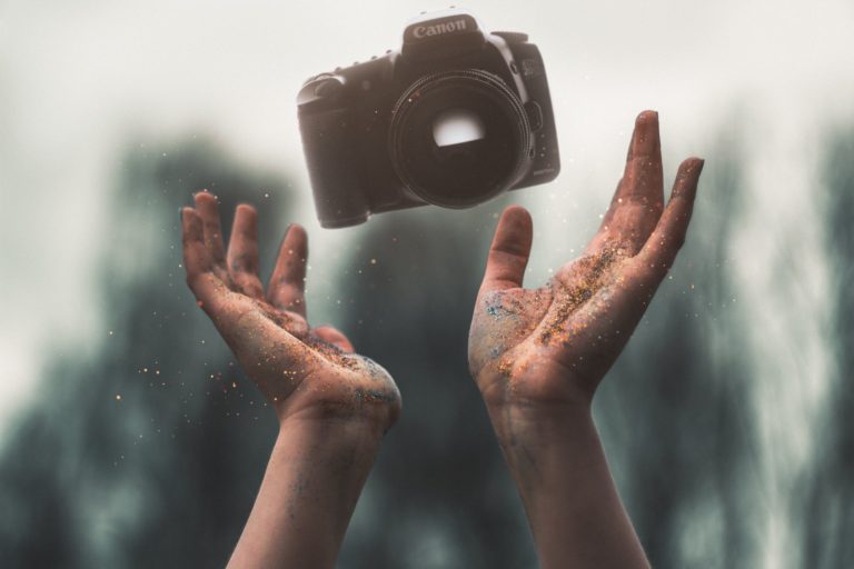 throwing camera in the air