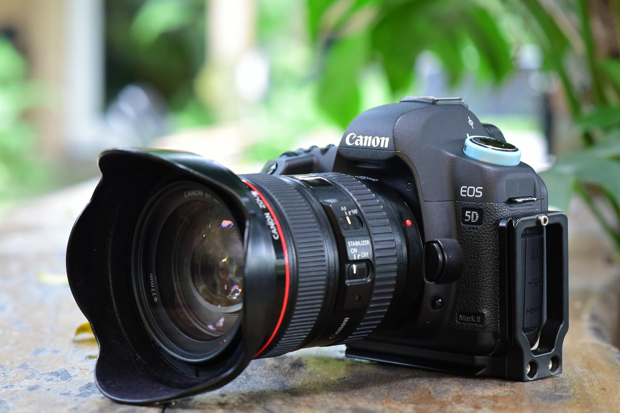 High-quality close-up of a DSLR camera with lens resting on a table.